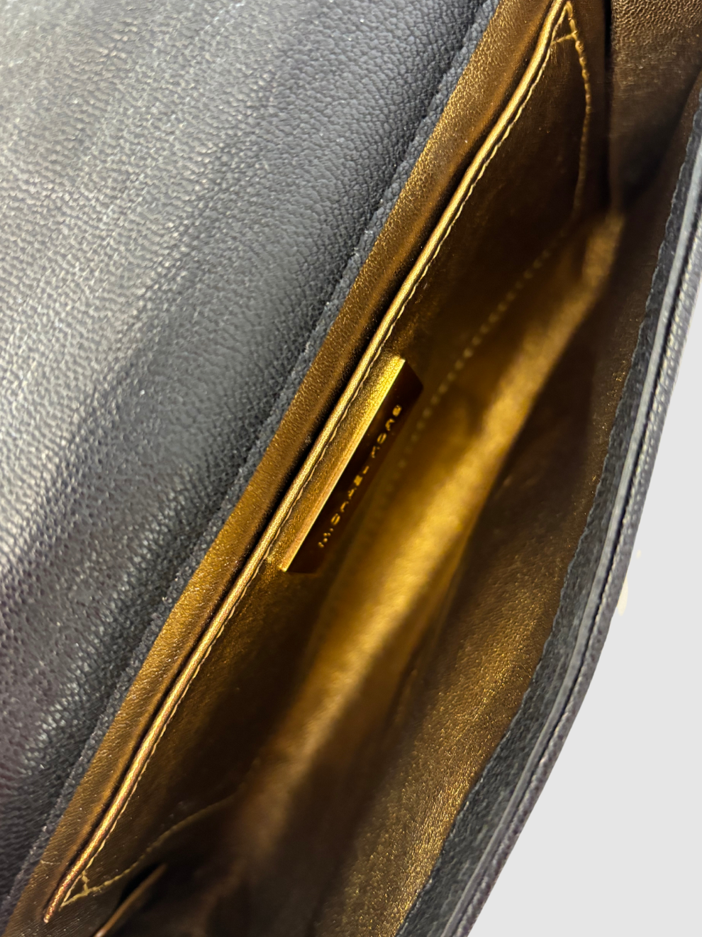 Schwarze gesteppte Leder-Clutch von Michael Kors