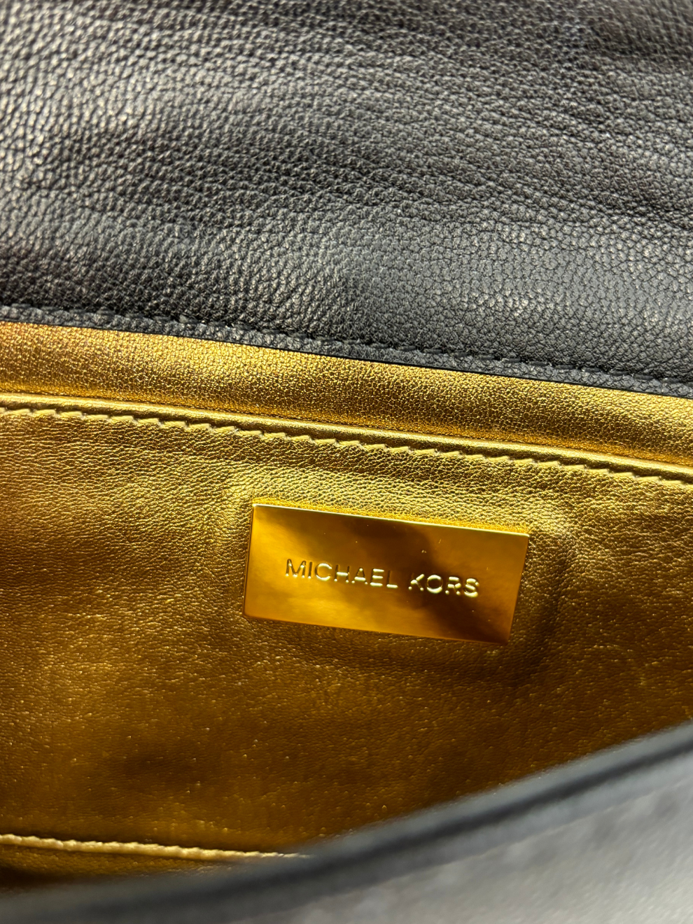 Schwarze gesteppte Leder-Clutch von Michael Kors