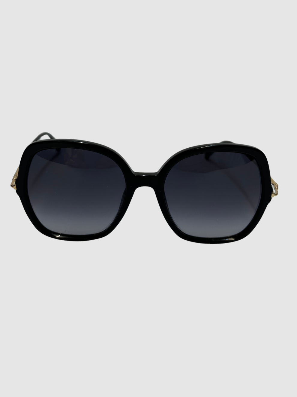 Schwarze Sonnenbrille mit goldenen dünnen Bügeln von Max Mara